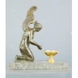 A bronze winged goddess raised on a marble base, 15cm by 14cm.
