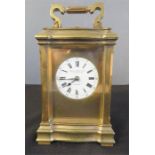 A brass carriage clock.