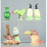 A group of ceramic animal figures, including duck salt and pepper.