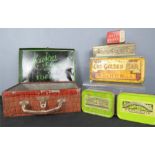 A group of collectable tins, including one in the form of a suitcase, Lyons Toffee etc.