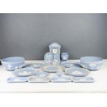A quantity of Wedgwood jasperware in pale blue, including mantle clocks, fruit bowls etc.