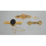 A 9ct gold Victorian sweetheart brooch, with chip diamond, a mourning brooch set with oval black