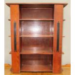 A 1930s oak stained bookshelf with Art Deco style detailing.
