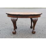 A small coffee table with scallop carved cabriole legs.