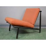 A mid century design easy chair, ebonised.