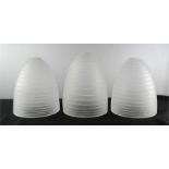 Three designer opaque glass shades, with spiral line decoration.