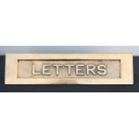 A brass 'Letters' letter box.