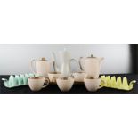 A quantity of Poole pottery, including two toast racks, coffee pot, four cups and saucers, sugar