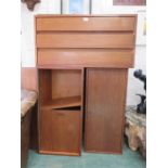 A cupboard and shelving unit composed of teak cupboard sections, and shelves.