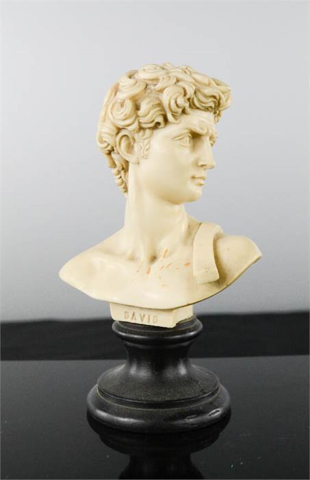 A miniature bust of David, on ebonised plinth, 14½cm high.