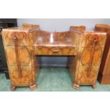A 1930s walnut veneered dressing table, with mirrored back.