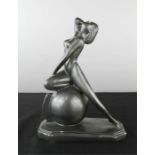 An Art Deco style figure of a woman.