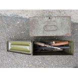 An ammunition box containing chisels etc.