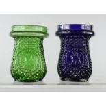 Two coloured glass jars/tea light holders, one blue and one green.