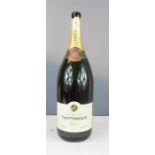 A Magnum Tattinger Champagne bottle, 59cm high. (no contents)