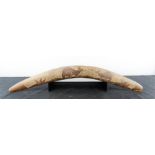 A treen boomerang, 59cm long.