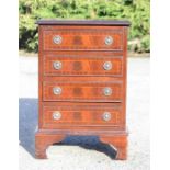 A small mahogany chest of drawers.