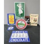 A group of enamel plaques, some advertising.