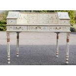A Chinese white lacquered desk with mother of pearl figures and gilded highlights, the curved raised