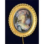 An 18ct gold brooch / pendant, the portrait miniature depicting a woman with feather headdress
