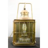 An antique brass lantern, converted to electric.