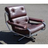 A Peiff red leather and chrome framed swivel chair.