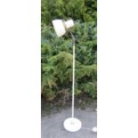 A 1980s white standard lamp with angle adjustable shade, 134cm high.