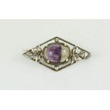 An Art Nouveau silver brooch with Blue John cabouchon set to the centre.