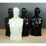 A group of black and white male mannequins.