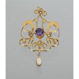 A 9ct gold Victorian pendant, set with a central circular amethyst and opal oval drop pendant 2.4g.