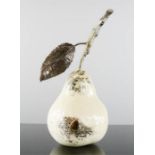 A ceramic and metal model pear.