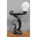 An Art Deco style table lamp; mermaid holding orb.