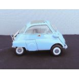 A model Bubble car in baby blue.