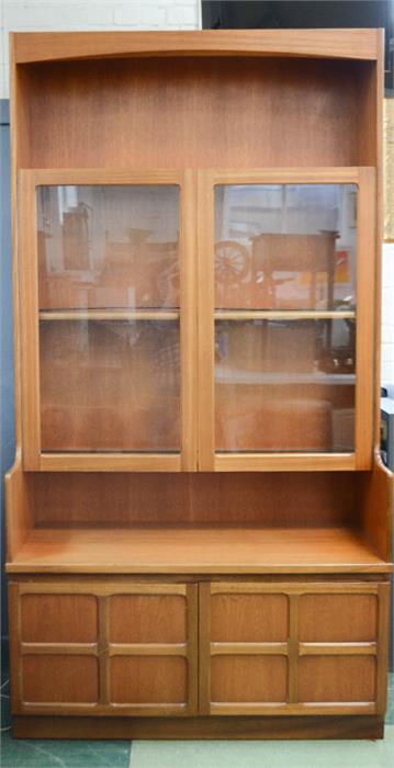 A G-Plan display unit, with two glazed doors, open upper shelf and two cupboard doors below.