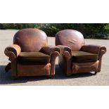 A pair of 1950s leather armchairs. A/F