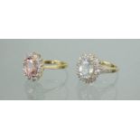 Two 9ct gold dress rings, one with pink oval cut stone, the other in white with cluster border, 5.6g