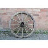 An antique cart wheel.