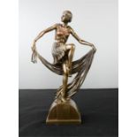 An Art Nouveau style figure of a woman.