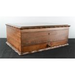 A 19th century rosewood box, with red silk lined and fret carved interior.