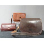 Three leather handbags.