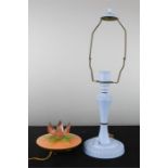 A retro bakelite lamp in the form of a lotus flower, and a baby blue bakelite lamp base.