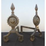 A pair of andirons.