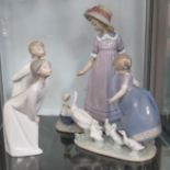 A group of four Lladro figures.