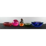 A group of glass paperweights and blue Murano glass ashtray.
