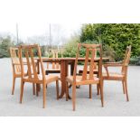 A Nathan dining table and set of six 1960s dining chairs including two carvers.