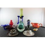 A bronze model of a hat and a similar steel hat, two glass candlesticks, kitch vases in red, blue
