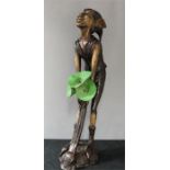 A bronze fountain in the form of a pixie.