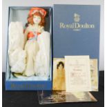A Royal Doulton doll, with original box and certificates.