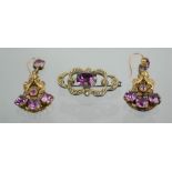 An amethyst and marcasite brooch and pair of earrings.