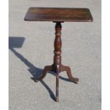 A 19th century oak tripod table.